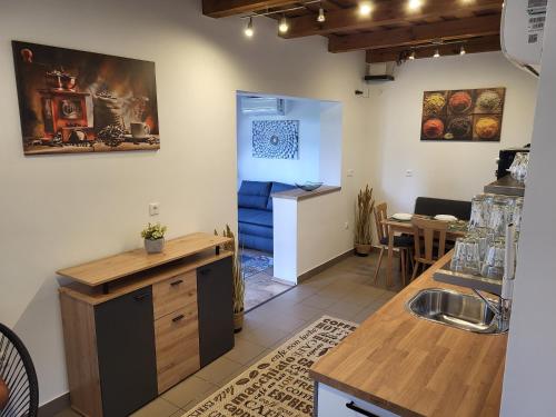a kitchen with a sink and a counter top at Spirit vendégház in Őriszentpéter