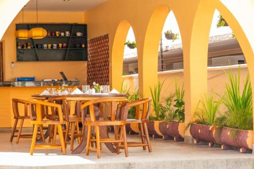 a dining room with a table and chairs at Bamburi Beach Villa in Mombasa