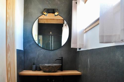 a bathroom with a sink and a mirror at Tindaya Nature Home Ocean View in Tindaya