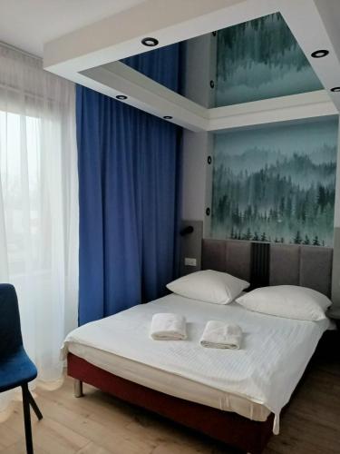Ένα ή περισσότερα κρεβάτια σε δωμάτιο στο Hotel Pomorski