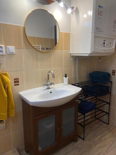 a bathroom with a sink and a mirror at 7 people - 1 price - Cozy attic apartment in Prešov