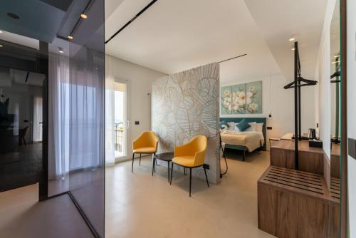 Ένα ή περισσότερα κρεβάτια σε δωμάτιο στο B&B Le Suites di Costanza