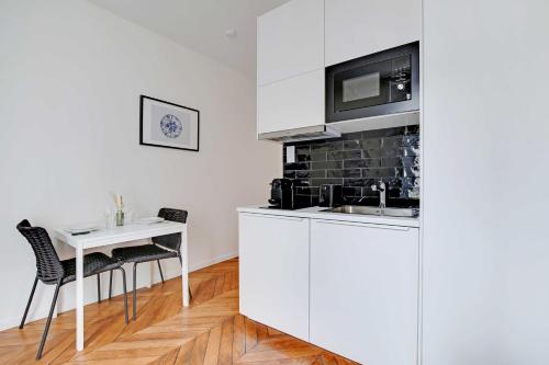 Kuchyň nebo kuchyňský kout v ubytování Résidence Thorez - Proche Paris