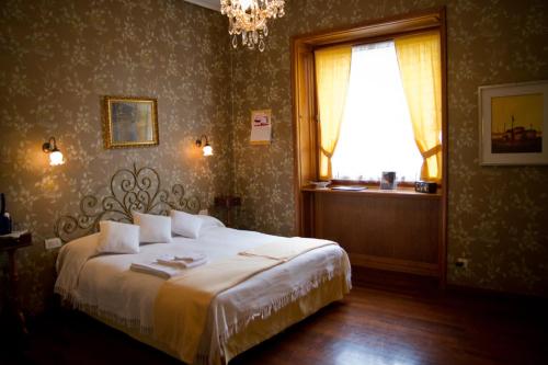 En eller flere senger på et rom på Locanda dei Buoni e Cattivi