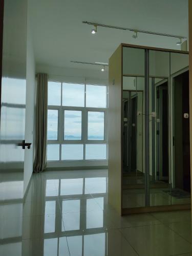 a bathroom with a mirror and a large window at Invincible Seaview Vacation Condo 3R3B 8Pax in Bayan Lepas