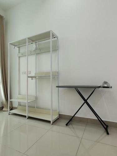 a white refrigerator sitting next to a white wall at Invincible Seaview Vacation Condo 3R3B 8Pax in Bayan Lepas