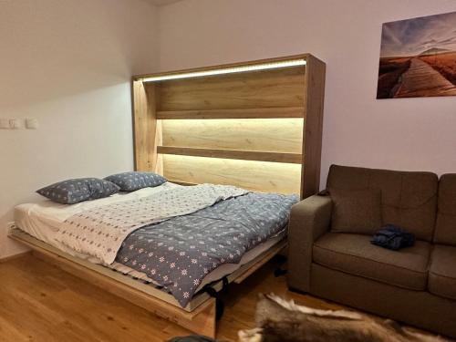 Postel nebo postele na pokoji v ubytování Apartmán 209 - Vlčice Residence