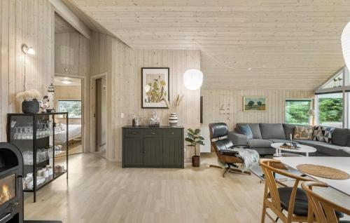 a living room with a couch and a table at Holiday Home Bæverstien Dnmk Vi in Marielyst