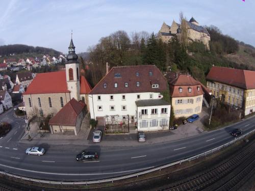 an aerial view of a town with a church and a street at Zum Schwarzen Adler in Mainberg
