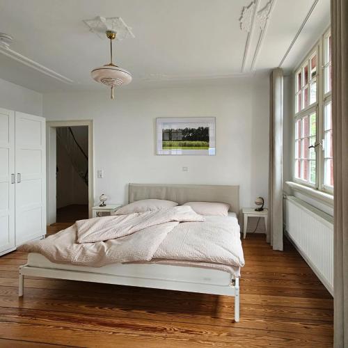 a bedroom with a bed in a white room at Villa Christina in Lindenfels