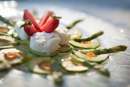 a plate of food with sushi and vegetables on it at Art Hotel Ristorante Posta Al Lago in Ronco s/Ascona - Porto Ronco