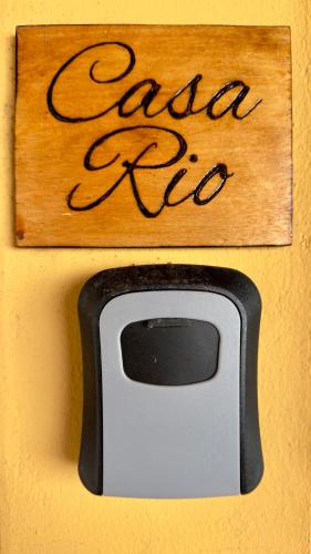 a sign that says extra tv on a wall at Vela de Estai in Vila Nova de Milfontes