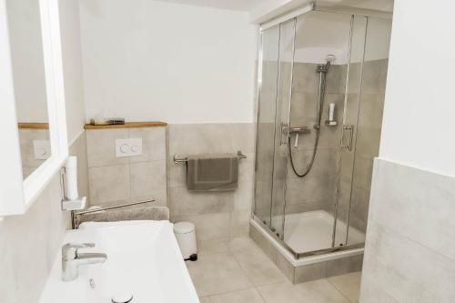 a bathroom with a shower and a sink at Kaiser's Hof in Strass