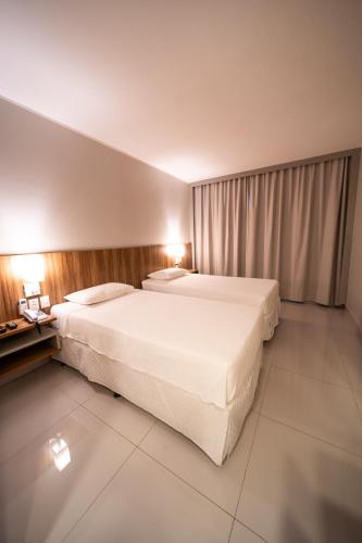 Postel nebo postele na pokoji v ubytování Stop Way Hotel Fortaleza