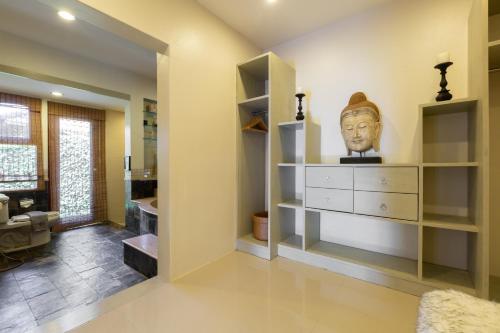 a room with a dresser with a head on it at Baan Lily in Chaweng