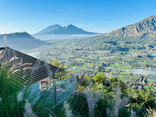 a view of a city from a mountain at Pinggan Campside Glamping in Baturaja