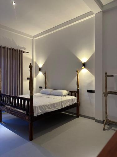 Una cama o camas en una habitación de Ruvee Villa