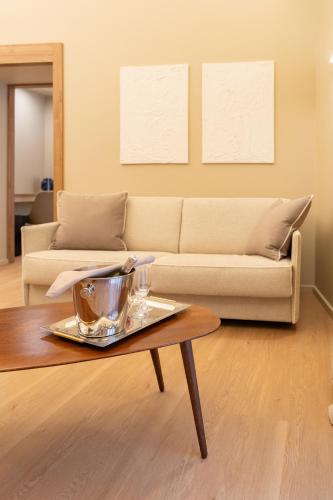 a living room with a couch and a coffee table at B&B La Residenza del Maestro - Catania Centro Storico in Catania