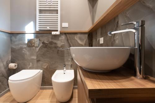 a bathroom with a sink and a toilet at B&B La Residenza del Maestro - Catania Centro Storico in Catania