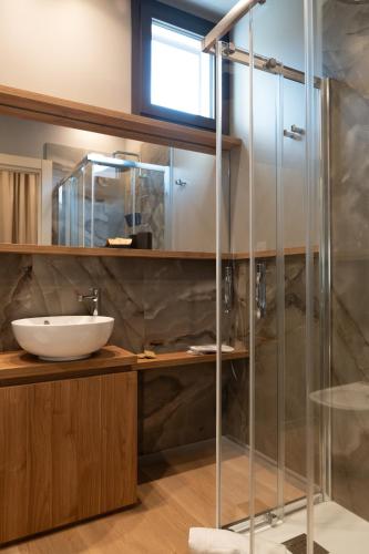 a bathroom with a glass shower and a sink at B&B La Residenza del Maestro - Catania Centro Storico in Catania