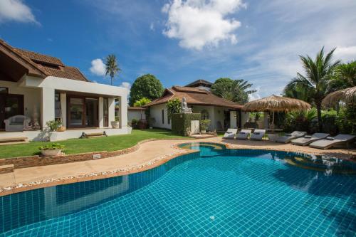 a swimming pool in the backyard of a villa at Baan Lily in Chaweng