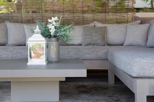 a living room with a couch and a coffee table at Baan Lily in Chaweng