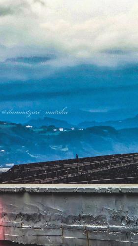 a painting of the ocean with a bird sitting on a ledge at Matzuri Nekazal Turismoa in Mutriku