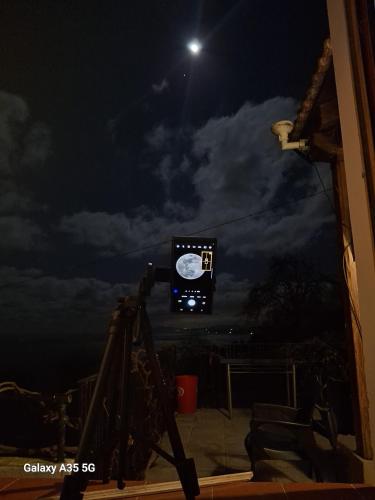 a night view of a television with a moon in the sky at Matzuri Nekazal Turismoa in Mutriku