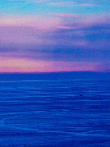 a painting of a sunset over the ocean at Matzuri Nekazal Turismoa in Mutriku