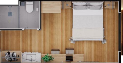 a floor plan of a room with a bed and chairs at Golden Tulip Canela in Canela