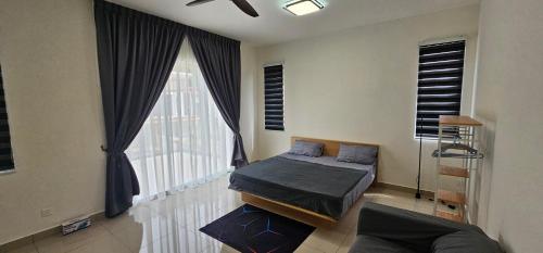 a bedroom with a bed and a large window at Suria Aman Homestay Semi-D 5 Rooms 5 Bathrooms in Taiping