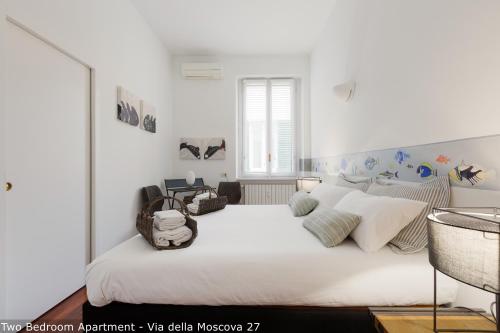 Posteľ alebo postele v izbe v ubytovaní Brera Apartments in Moscova