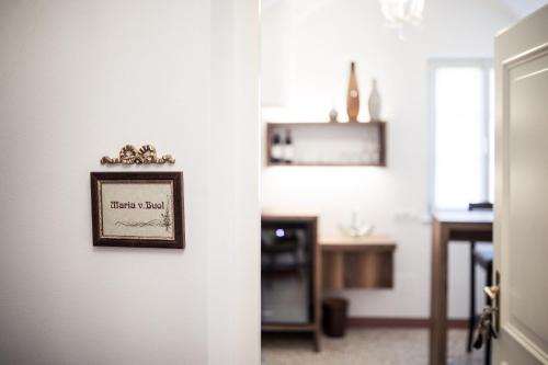 a room with a picture on the wall at Romantik Hotel Jagdhof in Caldaro