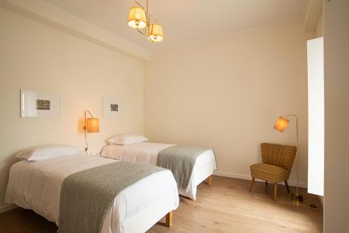 En eller flere senge i et værelse på Vila Marta - Estorninho