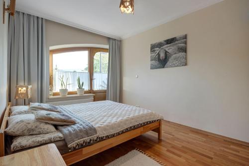 Posteľ alebo postele v izbe v ubytovaní Apartment Tatrachata