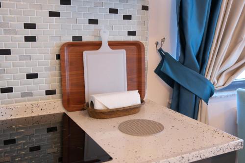 a counter top with a box of soap on it at Şahin Tepesi Suite Otel in Trabzon