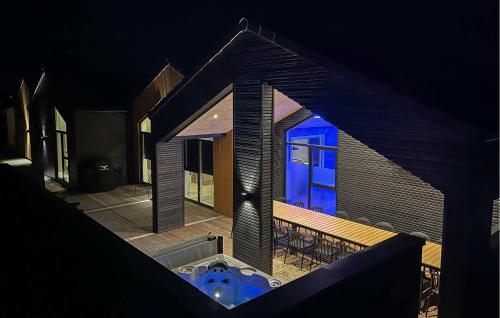 an aerial view of a house with a hot tub at Awesome Home In Løkken With Sauna in Løkken