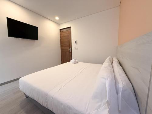 Кровать или кровати в номере Hotel Apartamentos Regency La Feria