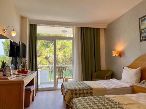 Postel nebo postele na pokoji v ubytování Transatlantik Beach Beldibi - All Inclusive