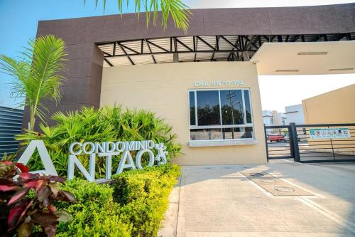 a building with a sign in front of it at Espectacular Casa de Ensueño "Jacuzzi Privado" en Ricaurte - Peñalisa in Ricaurte