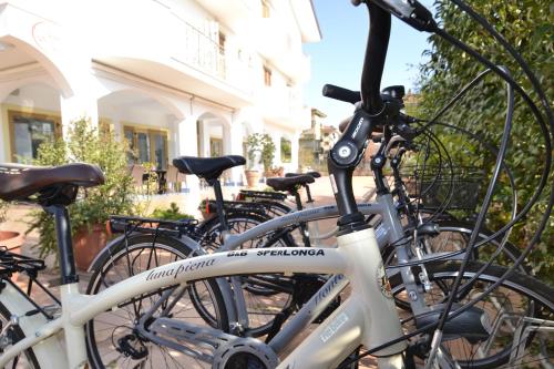 a group of bikes parked in front of a building at B&B Sperlonga in Sperlonga