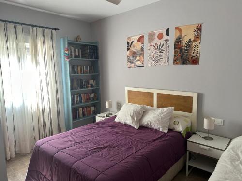 En eller flere senge i et værelse på Casa Sampalo