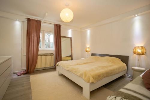 Ένα ή περισσότερα κρεβάτια σε δωμάτιο στο Comfort Suite Jelenovac