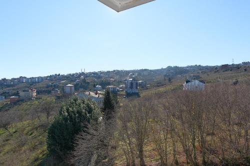 a view of a city from the top of a hill at Şahin Tepesi Suite Otel in Trabzon