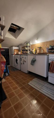 a kitchen with white appliances and a tile floor at Jolie chambre Privée Centre-Ville in Nice
