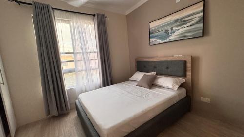Postel nebo postele na pokoji v ubytování 2br master en-suite in Vipingo, Kilifi