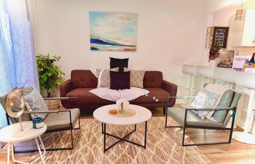 a living room with a couch and two chairs at Modern Home Near Uptown CLT, Airport and More in Charlotte