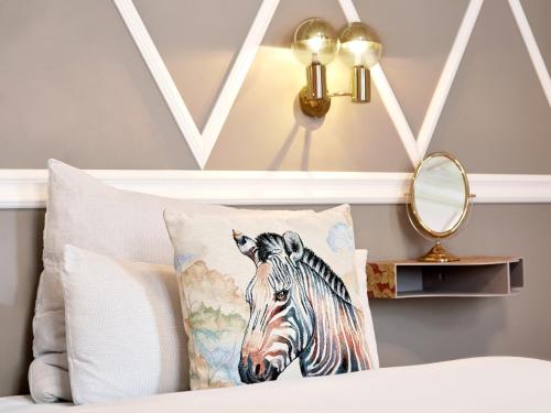 a pillow with a picture of a zebra on it at Linnen in Berlin