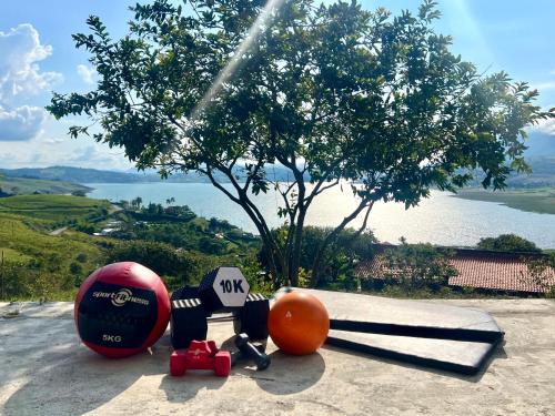 a group of exercise equipment sitting on top of a hill at Casa campestre Lago Calima in Calima