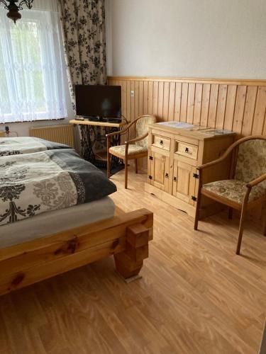 Postel nebo postele na pokoji v ubytování Ferienwohnung am Waldesrand